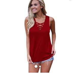 Cranberry sleeveless knit top.